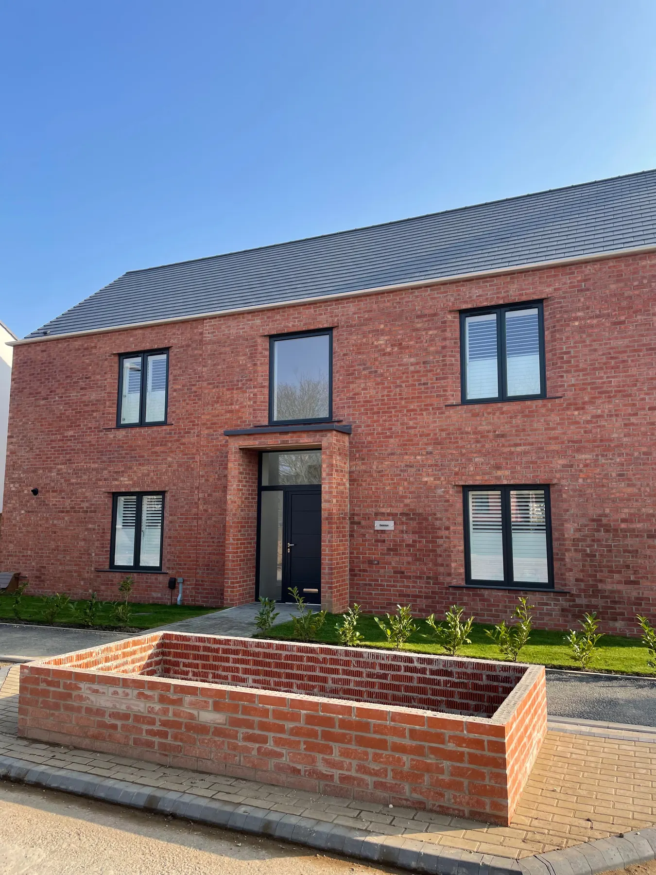 PM Windows installation: A dark entrance completing the elevation