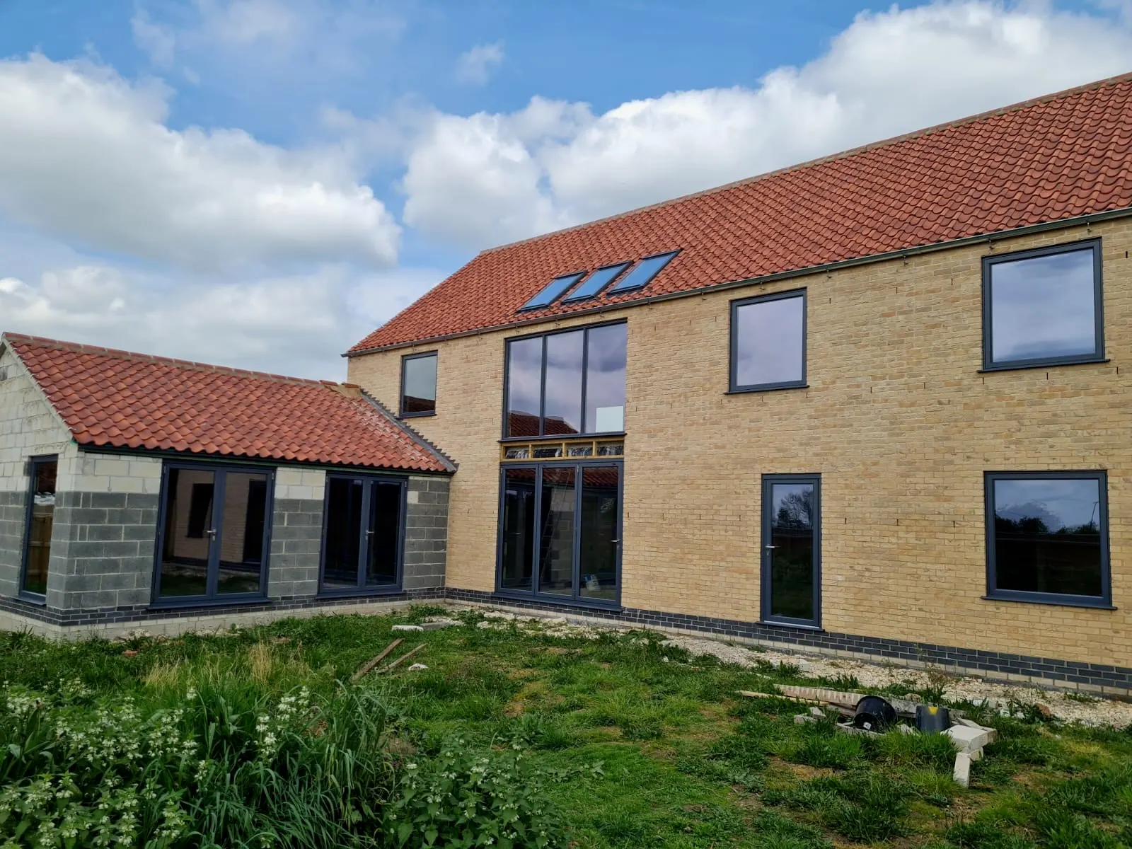 PM Windows installation: Dark aluminium windows across a character elevation