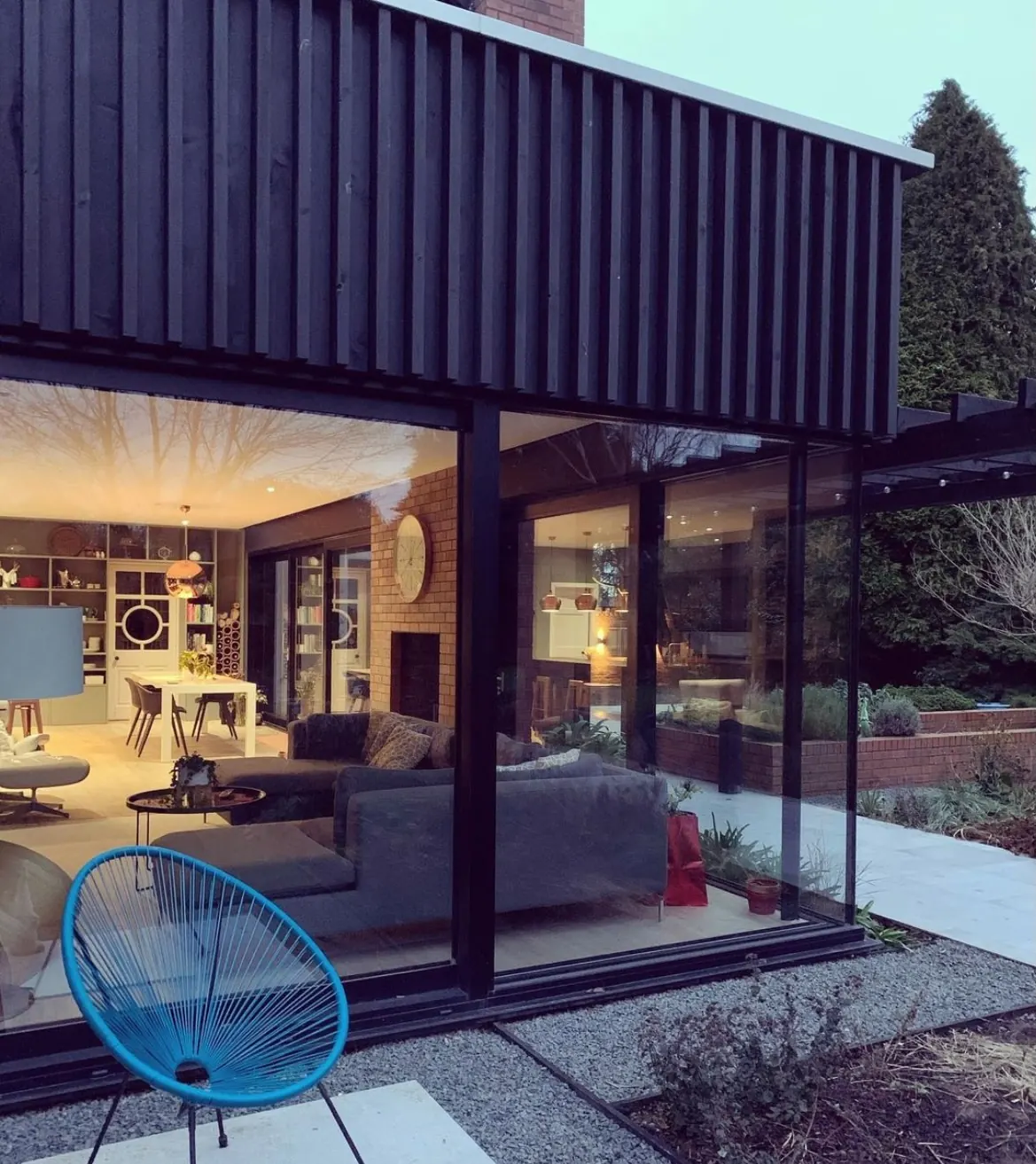PM Windows installation: Floor-to-ceiling glass at dusk