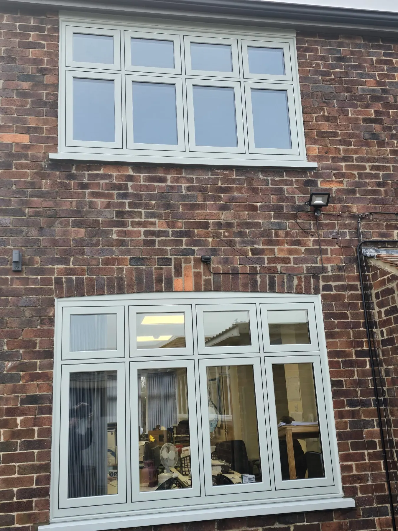 PM Windows installation: Balanced flush windows in warm brickwork