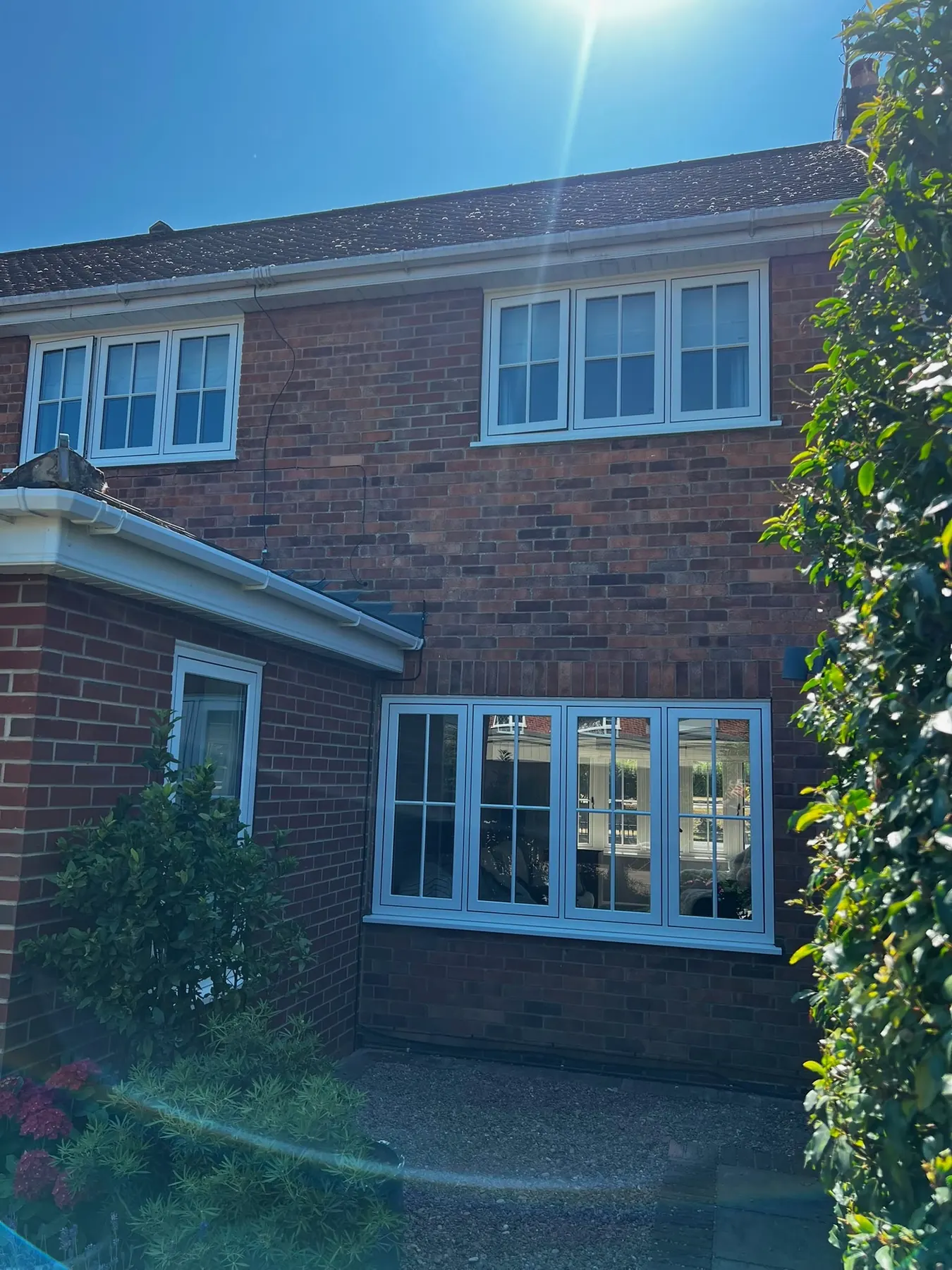PM Windows installation: Flush windows across a finished rear elevation